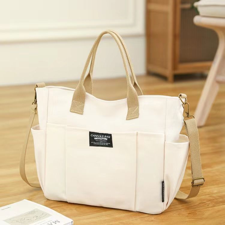 Large Capacity Canvas Shoulder Bag for Daily Commuting and Travel Use Bag