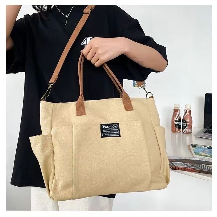 Large Capacity Canvas Shoulder Bag for Daily Commuting and Travel Use Bag